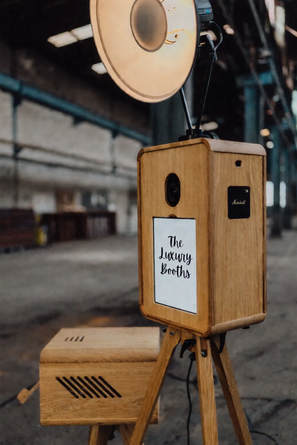 Guest enjoying vintage retro photo booth with instant prints